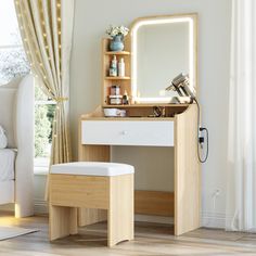 a dressing table with a mirror, stool and lights on the wall in front of it