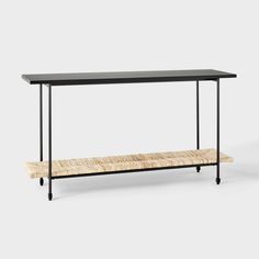 a black table with a bench underneath it