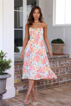 Length from shoulder to hem of size S: 108cm. 
 Chest 37cm, Waist 29cm, size S. 
 Midi dress.  
 Lined. 
 Model is a standard XS and is wearing size XS.  
 True to size.  
 Stretch. 
 Elastic back. 
 Flowy skirt. 
 Slip on. 
 Cold hand wash only.  
 Polyester/Spandex. 
 Please note: This style is exclusive 
 
 It's giving girly, fun vibes. Field Of Memories Midi Dress features an elastic back and flowy skirt that is simply gorgeous for the warmer seasons. Style with heels to get the attention st Fun Vibes, Women Lace Blouse, White Prom Dress, Bridal Shower Dress, Long Bodycon Dress, Shower Dresses, Feather Dress, Long Sleeve Lace Dress, Mini Dresses Summer