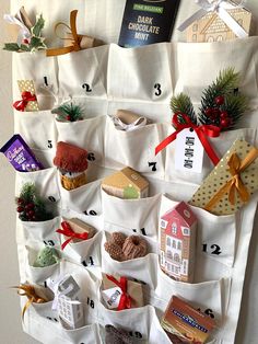 a christmas stocking hanging on the side of a wall with presents and gifts in it