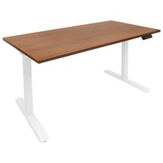 a wooden desk sitting on top of a white metal stand up leg with an open end