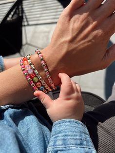 One of Helena's favorites! The Smile Beaded bracelet is a fun piece to add some variety and color to any stack! Wear your smile on your sleeve, and draw some more attention to your GH stack with these fun colors! Material: 18K Gold Filled Bead Size: 6mm Length: 6' inches (Stretches to 6.5') Chain Type: Beaded Everyday Multicolor Stretch Bracelet With Spacer Beads, Everyday Multicolor Tiny Beads Bracelet, Everyday Colorful Beaded Stretch Bracelet, Colorful Beaded Bracelets With Spacer Beads As Gift, Colorful Heishi Beads Bracelets For Friendship, Everyday Multicolor Tiny Beads Bracelets, Playful Pink Beaded Bracelets, Rainbow Beaded Bracelets With Spacer Beads For Friendship, Colorful Bracelets With Spacer Beads As Gift