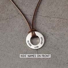 "► DESCRIPTION This coated leather cord necklace with kids' names engraved on the pendant will be a wonderful gift to any father or husband on his special days. You can also add a personalized message on the back of the pendant, which will be cherished for many years by the recipient. ► PRODUCT DETAILS * Materials: PU leather cord with sterling silver pendant * Dimensions: Pendant measures approx.7/8\" (23mm) with quality, thick gauge * Word limit: up to 4 names on the front; up to 8 short words Dad Necklace, Birthday Gift For Husband, Necklace With Kids Names, 1 Year Anniversary Gifts, Leather Cord Necklace, Leather Colors, Short Words, Birthday Gifts For Husband, Leather Corded Necklace