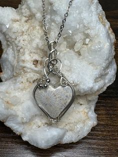 This beautiful detailed fossil coral heart pendant is roughly 2" tall and 1" wide, it comes with a complimentary 18" stainless steel chain, and in a gift box, ready for gifting!  These are not costume pieces that will chip away or rust over time. They will last forever if taken care of, which is why I include a free polishing cloth with every order.  All of my pieces are made with high quality wire from Rio Grande. Quality is very important to me.       If you have any questions, message me, I'm happy to help. Natural Stones Jewelry Gift, Nickel-free Heart Pendant Jewelry For Keepsake, Nickel-free Heart Pendant Keepsake Jewelry, Artisan Silver Heart Pendant Necklace, Handmade Heart Pendant Jewelry Keepsake, Handmade Heart Pendant Jewelry For Keepsake, Handmade Heart Pendant Necklace, Nature-inspired, Unique Silver Necklaces For Valentine's Day, Handmade Double Heart Necklaces For Anniversary