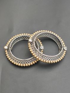 You will receive  2 Pcs  Dual Tone Silver Oxidized Bangle Bracelet ( Kada )For Women Openable Screw Bangle Handmade Antique Look Vintage Style Jewelry Made Of Brass. Metal: Brass 1 - Bangle Width :   15 mm  Approx. Bangle inner diameter :  2.1 inches Approx. 2 - Bangle Width :   1.5 mm  Approx. Bangle inner diameter :  2.2 inches Approx.       Thank you very much for visiting ! Any questions, please feel free to contact us. Discount for bulk provide. Festive Fusion Metal Bracelets, Dual-tone Gold Bracelets As Gift, Gold Dual-tone Bracelet For Gift, Dual-tone Gold Bracelet As Gift, Dual-tone Gold Bracelet For Gift, Traditional Gold Bracelets With Oxidized Finish, Traditional Gold Bracelet With Oxidized Finish, Elegant Gold Bangle With Oxidized Finish, Gold Bracelet With Oxidized Finish As A Gift