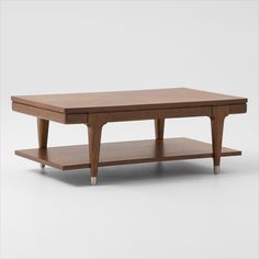 a wooden coffee table with two shelves on each side and one shelf below the top