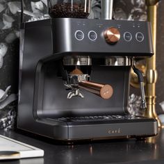 an espresso machine sitting on top of a counter