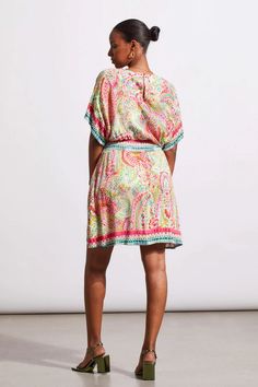 Add a rush of color to your collection with this v-neck dress featuring border prints and flowy dolman sleeves. We're also loving the additional waist accent and the functional back-of-neck opening. V-neckline Dolman sleeveBack neck functional opening Waist accent Machine wash delicate cycle cold water, separately, do not bleach, line dry, medium iron if needed. Bohemian Multicolor V-neck Dress With Short Sleeves, V-neck Viscose Kaftan For The Beach, Green V-neck Kaftan With Vibrant Print, Flowy Summer Dress With Kimono Sleeves, Multicolor Flowy V-neck Kaftan, Vibrant Print V-neck Tunic, Multicolor Boho Print V-neck Dress, Multicolor Flowy Dress With Surplice Neckline, Printed Rayon V-neck Dress