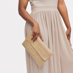 Depending on your style and the season, it is the accessory to ideally complete your outfit. It can be worn both during the day and in the evening and brings a dose of elegance to your looks. It's also a great gift idea to spoil your loved ones. Natural colored raffia pouch with a little gold touch, can be carried in the hand. -Closing with a flap with 2 snap buttons and a zipper -Cotton lining - Dimensions: 29 x 20 cm Elegant Rectangular Straw Bag For Spring, Trendy Spring Straw Pouch Bag, Trendy Pouch Straw Bag For Spring, Trendy Spring Pouch Straw Bag, Chic Beige Straw Crochet Bag, Chic Summer Straw Bag In Natural Fiber, Elegant Summer Clutch Bag, Chic Straw Shoulder Bag, Elegant Straw Bag For Day Out