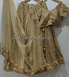 Indian wedding lehenga with embroidered blouse & dupatta for women. * Plus size available at a small up-charge. * Size: This is custom made outfit as per your size. Post your order we will send you a measurements reference sheet using which you can provide details required to make your outfit with best fit. * Fabric and work: Lehenga - Antique gold sequine fabric with very good quality lining and lace border. Blouse - Sequins fabric. Dupatta - Dupatta is in gold net with embroidery lace border o Traditional Drape Gold Sharara With Sequins, Gold Sharara With Sequins In Traditional Drape, Gold Sharara With Sequins And Traditional Drape, Gold Anarkali Set With Mirror Work For Party, Gold Sequined Sharara For Party Wear, Gold Sequined Traditional Sharara, Designer Gold Dola Silk Lehenga, Gold Sequined Sharara For Festivals, Festive Gold Lehenga With Mirror Work