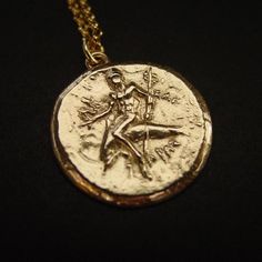 Taras Boy on Dolphin Coin Reproduction Necklace | Ancient Greek Coin Jewelry Mythological Medallion Jewelry In Gold, Mythological Medallion Jewelry Gift, Mythological Style Gold Coin Pendant Jewelry, Gold Mythological Coin Pendant Jewelry, Gold Mythological Jewelry With Coin Pendant, Mythological Round Pendant Necklace For Gifts, Mythological Round Pendant Jewelry As Gift, Gold Mythological Engraved Necklace, Gold Engraved Mythological Necklace