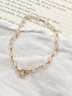 Introducing our Gold Chain Bracelet with Rose Quartz - a gracefully crafted piece that radiates elegance and feminine charm. This bracelet features a high-quality gold chain that adds a touch of timeless sophistication, beautifully complemented by the soft, delicate hues of genuine rose quartz gemstones. The arrangement of the gold links and rose quartz stones creates a harmonious and eye-catching design, making this bracelet a versatile accessory suitable for various occasions. The secure clasp Gold Rose Quartz Bracelets For Jewelry Making, Elegant Pink Chain Bracelet With Adjustable Chain, Elegant Rose Quartz Crystal Bracelet Gift, Elegant Rose Quartz Crystal Bracelet For Gift, Adjustable Gold Rose Quartz Jewelry, Elegant Gold Bracelets With Rose Quartz, Elegant Pink Gold Jewelry With Chain, Elegant Pink Gold Chain Jewelry, Elegant Rose Quartz For Jewelry Making