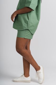 Trendy shorts from Lush Fashion Lounge women's boutique in Oklahoma City. Lush boutique in OKC has a variety of cute shorts and more! Pair these cute shorts with the matching button up top, SOLD SEPARATELY, for a cute look! We are loving cute matching sets for Spring! Model is 5'7 size 26 wearing size small. 100% cotton Green Cotton Bottoms With Built-in Shorts, Spring High-waisted Bermuda Shorts With Built-in Shorts, Green Bottoms With Built-in Shorts For Spring, Summer Cotton Skort With Built-in Shorts, Trendy Short Skort With Built-in Shorts, Trendy Cotton Skort With Built-in Shorts, Green Cotton Shorts For Day Out, Casual Green Jean Shorts For Summer, Relaxed Fit Biker Shorts For Spring