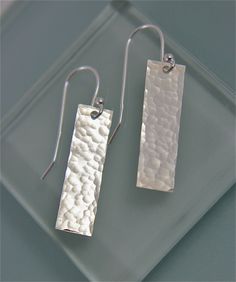 "These earrings are Sterling Silver Rectangles 1\" long by 3/8\" wide simple and just the right size, they are hammered, punched, and polished to a bright shine. They are hanging on a simple sterling silver ball earwire. Substsantial yet light every day earrings. Made from Recycled Silver. All items are presented in a 100% recycled paper box with a paper raffia bow. Thank you for looking at my shop. http://www.etsy.com/shop/tinysparklestudio?ref=si_shop For vintage clothing and uniquities, check Sterling Silver Jewelry Cleaner, Recycled Silver Jewelry, Homemade Jewellery, Silver Wire Jewelry, Simple Silver Earrings, Stamped Necklaces, Metal Stamped Jewelry, Silver Jewelry Box, Silver Wedding Jewelry