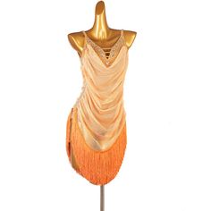 a mannequin with an orange dress on it's head and fringes