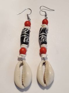 Black White Ghana Krobo Cowrie Shell Dangle Earrings https://etsy.me/35k1qNV Black Beach Jewelry With Dangling Beads, Beach Jewelry With Black Dangling Beads, Black Dangling Beads Jewelry For Beach, Gift White Beaded Earrings With Black Beads, White Bohemian Beaded Earrings With Black Beads, Bohemian White Earrings With Black Beads, White Dangle Jewelry With Black Beads, Black Beaded Earrings For Beach, Black Beaded Earrings For The Beach