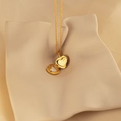 Our Mother of Pearl Heart Locket combines both sentimentality and elegance. Insert any picture that is close to your heart in the dainty locket charm and allow that image to bring you peace whenever you need it. The delicate chain and pendant are perfect for layering with your other meaningful pieces to create a nostalgic jewelry look. SKU: RR-NR171 Product Details Material: High Quality Solid 925 Sterling Silver Finish: Sterling Silver ∙ 18K Gold Locket comes without a photo. Photo insertion se Elegant Locket Necklace With Heart And Initial Pendant, Dainty Heart Pendant Locket Necklace With Charm, Dainty Heart Locket Necklace With Charm, Heart Shaped Dainty Locket Necklace With Delicate Chain, Dainty Heart Locket Necklace With Delicate Chain, Dainty Medallion Charm Necklace As Keepsake, Elegant Double Heart Locket Charm Necklaces, Elegant Heart Locket Charm Necklace, Initial Pendant Locket Necklace With Charms As Gift