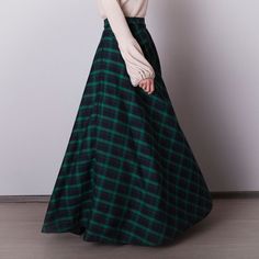 Black and green plaid skirt: - Side seam pockets - Hidden zipper in the side seam - Separate sash - Classic tartan pattern - Fabric is 40% wool, 58% polyviscose, 2% of elastane Model is 6'2'', she wears US 8 size US 0  Bust 82 cm (32.5 inches) Waist 64 cm (25 inches) Hips 89 cm (35 inches) US 2  Bust 85 cm (33.5 inches) Waist 66 cm (26 inches) Hips 92 cm (36 inches) US 4  Bust 88 cm (34.5 inches) Waist 68 cm (27 inches) Hips 94 cm (37 inches)  US 6  Bust 90 cm (35.5 inches) Waist 71 cm (28 inches) Hips 96 cm (38 inches)  US 8  Bust 93 cm (36.5 inches) Waist 74 cm (29 inches) Hips 99 cm (39 inches) US 10  Bust 95 cm (37.5 inches) Waist 76 cm (30 inches) Hips 102 cm (40 inches) US 12  Bust 99 cm (39 inches) Waist 80 cm (31.5 inches) Hips 105 cm (41.5 inches) US 14  Bust 103 cm (40.5 inches) Green Lined Maxi Skirt For Fall, Fall Green Lined Maxi Skirt, Green Full Maxi Skirt For Fall, Long Green Skirt For Fall, Green Lined Skirt For Fall, Classic Outfit Women, Green Skirt For Fall, Green Long Skirt For Winter, Green Fitted Maxi Skirt For Winter