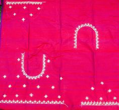 a pink cloth with white stars on it and the letter u written in large letters