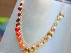 THE JEWELRY IS SHIPPED via DHL EXPRESS (2-5 days delivery door to door). THE DHL SHIPPING COST IS INCLUDED IN THE PRICE.The Sunset Necklace - Multi Gemstone Orange Red Drop Necklace, Semi Precious Colorful Necklace► Measurements / Details:- Necklace Length: Made to Order- Gold: High quality Gold Filled- Silver: High quality Sterling Silver► Gemstones:The necklace includes excellent AAA quality precious gemstones:~ Scapolite~ Lemon Quartz~ Citrine in several shades~ Honey Quartz~ Padparadscha Sap Red Dangle Jewelry With Gemstone Accents, Multicolor Multi-stone Teardrop Necklace, Fine Jewelry Red Necklaces With Gemstone Accents, Orange Briolette Jewelry For Gift, Elegant Multicolor Citrine Jewelry, Multicolor Drop Gemstone Necklaces, Red Briolette Necklaces For Jewelry Making, Orange Gemstone Drop Jewelry, Red Briolette Gemstone Beads Necklace