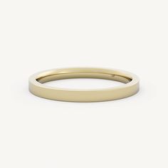 a plain yellow gold wedding ring on a white background