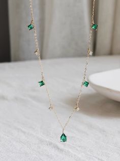 custom order 5-6 weeks  length 42cm (adjustable at 40cm)  crystal 4x 6.5mm  green crystal 3mm  clear crystal 2mm  ITEM CAN NOT BE RETURNED  Material: 14 karat. Only solid gold. NO gold filled / NO gold plating   Gold Info:  24K gold is 100% pure 18K contains 75% gold and 25% alloyed metals 14K is 58.5% gold and 41.5% alloyed metals 9K contains 9 parts pure gold and 15 parts additional metals such as silver, tin, nickel, zinc, palladium, etc. ----------------------------------------------------------------------  quality, simplicity, reasonable price For questions or inquiry please do not hesitate to contact us. We will be happy to assist you.  SHIPPING: 1. Shipping takes approximately 3-5 business days (exclude weekend and holiday) for domestic customer.  Shipping via USPS five days a week Green Charm Necklace With Dangling Charms For Gift, Delicate Green Necklace With May Birthstone, Delicate Green May Birthstone Necklace, Green Necklace With Dangling Charms As Gift, Green Necklace With Dangling Charms For Gift, Minimalist Green Emerald Necklace With Delicate Chain, Green Dangle Charm Necklaces, Green Necklaces With Dangling Charms As Gift, Green Elegant Dangle Crystal Necklaces