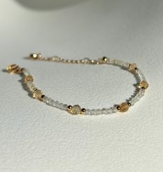 Joy * Positivity * Abundance  - 2mm Citrine beads  - 4mm Citrine beads  - Gold plated  - +2in adjustable chain  Please don't hesitate to contact me if you have any questions!  ☺️ Illuminate your path with our citrine bracelet, a radiant beacon of warmth and optimism. Known for its vibrant golden hues and energizing properties, citrine helps unlock your inner abundance and creativity. Wear this luminous bracelet as a talisman to attract positivity, boost your confidence, and celebrate the joy tha Adjustable Gold Beaded Bracelets With Gemstone, Elegant Yellow Beaded Bracelets With Gold Beads, Elegant Yellow Beaded Bracelet With Gold Beads, Gold Faceted Beaded Bracelets For Everyday, Handmade Dainty Gold Crystal Bracelet, Elegant Gold Citrine Crystal Bracelet, Adjustable Gold Crystal Bracelet With Gemstone, Adjustable Gold Crystal Gemstone Bracelet, Gold Dainty Beaded Bracelets With Faceted Beads