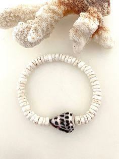 White Shell Bracelet, Beaded Shell-shaped Bracelets For Beach, Puka Shell Bracelet, Hebrew Cone Shell, Sea Shell Bracelet, Ocean-inspired Shell-shaped Bracelets For The Beach, Shell-shaped Shell Bracelets For Beach, Paris Charm Bracelet, Adjustable Shell-shaped Beach Bracelet