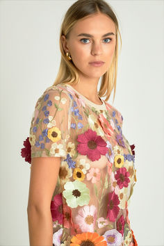 The Floral Embroidered Top is a must-have this season to show off your style. Crafted with beautiful floral embroidery this regular fit top features short sleeves a round neckline and a figure-flattering fit. Unique eye-catching and stylish this top is the perfect fit for all occasions. Look and feel your best with this must have piece in your wardrobe.