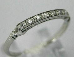 a white gold ring with diamonds on it