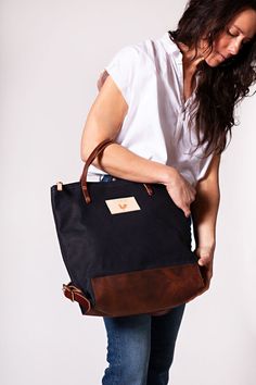 DESCRIPTION Designed for all those beautiful multi-tasking women in the world. This 2-way convertible bag simplifies travel life, mom life, work life, and an adventurous life. You get perfect functionality with the backpack's removable/adjustable straps or carry as a hand tote. No matter what your day brings you, you a Waxed Canvas Backpack With Leather Handles For Everyday Use, Everyday Waxed Canvas Backpack With Leather Handles, Rectangular Waxed Leather Backpack, Everyday Leather-handled Coated Canvas Backpack, Waxed Canvas Backpack With Leather Handles, Waxed Canvas Backpack With Waxed Finish, Waxed Canvas Tote Weekender Bag, Everyday Leather Patch Standard Backpack, Waxed Canvas Satchel Backpack With Waxed Finish