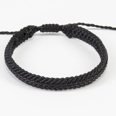 "Black bracelet for men  beautiful Christmas gift for teenage boy. Black woven bracelet perfect stocking stuffer for boyfriend. Black macrame bracelets made from waxed thread. The centre of the bracelet has a different knotting style. Each thread knotted together to make this extremely interesting pattern. These bracelets are gender-neutral. The width of the bracelet is 7 millimeters.  The bracelet closes with an adjustable design. There are two options: 15cm for regular/average wrist size and 17cm for larger wrists.  See our store for other bracelet designs https://www.etsy.com/shop/LookAtYouXania Please feel free to message me with any special orders: *Different colours  *Sizes *More than one All of our bracelet designs are extremely durable. They are waterproof because of their waxed th Casual Black Braided Bracelets For Friendship, Casual Black Braided Friendship Bracelets, Handmade Black Wristband For Friendship, Black Adjustable Casual Friendship Bracelets, Handmade Black Friendship Bracelets For Gift, Handmade Black Friendship Bracelets Gift, Black Casual Friendship Bracelets With Adjustable Cord, Adjustable Black Friendship Bracelet, Black Adjustable Cord Friendship Bracelets