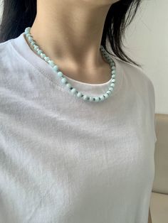 Introducing our Amazonite Stone Beaded Necklace, part of our Missy Jewelry Natural Stone collection. With its elegant and adjustable design, this turquoise necklace is perfect for both casual and formal occasions. Made with natural Amazonite stones and silver-plated copper alloy, it weighs approximately 25.13 g and features a 6 mm stone size. Enjoy the soothing and calming benefits of Amazonite while looking stylish. Details Material: Natural Amazonite stones, silver-plated copper alloy Color: Turquoise with silver detailing Length: Approximately 48.5 cm (including 5 cm extension chain) Weight: Approximately 25.13 g Stone Size: Approx. 6 mm Style: Elegant, adjustable necklace for casual and formal occasions Missy Jewelry Natural Stone Necklace Collection Amazonite Necklace With Polished Beads As Gift, Single Strand Amazonite Beaded Necklaces As Gift, Gift Amazonite Single Strand Beaded Necklace, Adjustable Turquoise Beaded Amazonite Necklaces, Adjustable Light Blue Necklaces With Natural Stones, Turquoise Single Strand Amazonite Necklace, Turquoise Amazonite Beaded Necklace, Adjustable Turquoise Necklace As A Gift, Adjustable Turquoise Necklace For Gift