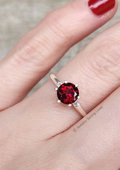 ------------------------------------------------------- Brilliant Cut Garnet Ring THE PRODUCT - This is an extremely unique vibrant brilliant cut round garnet ring. We hand selected each individual stone to make sure they are radiant and full of color. - The cut style known as 'brilliant' makes it catch every ray of light and reflect it back making this stone extremely bright and radiant for a natural garnet! - What makes this garnet ring so unique is the mesmerizing glow and bright red hues it Round Garnet Ring, Pink Gold Rings, Moss Agate Jewelry, Red Gemstone Ring, Blue Sapphire Studs, Gemstone Engagement Ring, Ray Of Light, Agate Engagement Ring, Moss Agate Ring