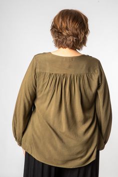 Stevie Nicks called and she wants her summer of love inspired hippie top back. This perfect lightweight long-sleeve embroidered peasant top can amplify any outfit from 1970s hippie to modern metropolitan boho chic. With tasseled drawstrings and delicate embroidery accenting a v-neck cut, this simple top is surely a staple for any closet. Did we mention the cinched sleeves? Pair it with pants, a loose flowy skirt, leggings, or shorts, your top half is covered and the rest of the outfit is up to y Casual Embroidered V-neck Top For Fall, Flowy V-neck Rayon Peasant Top, Bohemian Embroidered Top With Boho Collar, Casual Embroidered Top With Boho Collar For Spring, Bohemian Embroidered Long Sleeve Top With Boho Collar, Bohemian Long Sleeve Embroidered Top With Boho Collar, Chic Long Sleeve Embroidered Top For Fall, Bohemian Embroidered Top With Long Sleeves, Bohemian Embroidered Long Sleeve Top In Relaxed Fit