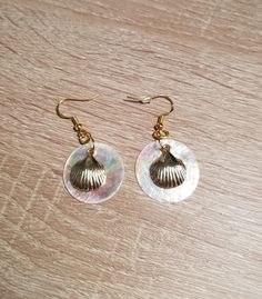 These earrings are made with gold-colored stainless steel and "Mother of Pearl" sea shells.  The studs, hooks, starfish, and clam shells are stainless steel. They are lightweight and perfect for summer vibes. Taxes are included in the price. Sea Shell Earrings, Clam Shells, Wedding Jewelry Earrings, Shell Earrings, Sea Shell, Gold Stars, Wedding Earrings, Starfish, Summer Vibes