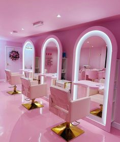 the interior of a pink and white salon