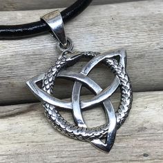 "925 Sterling Silver Triquetra Snake Ouroboros Uroborus Pendant Necklace Pendant size: 1.10\"x1.10\" (28x28mm) Included 18 inches (45 cm) black leather cord with a lobster clasp and extender. Also you can add charms and personalize your necklace: http://etsy.me/2x6JVSr ENTER MY SHOP HERE: KalismaBijoux.etsy.com HANDMADE by ME - All my work is crafted with the utmost care in my studios - in Madrid, SPAIN CHANGES Don't hesitate to contact me if you have an idea or request. ABOUT MY PROCESS I am ge Spiritual Stainless Steel Nickel-free Jewelry, Spiritual Stainless Steel Pendant Jewelry, Spiritual Antique Silver Nickel-free Jewelry, Symbolic 925 Silver Jewelry Gift, Spiritual Stainless Steel Jewelry With Oxidized Finish, Symbolic Antique Silver Jewelry Gift, Silver Stainless Steel Amulet Jewelry, Antique Silver Symbolic Jewelry For Gift, Oxidized Pendant For Meditation