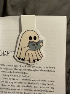 an open book with a ghost reading a book