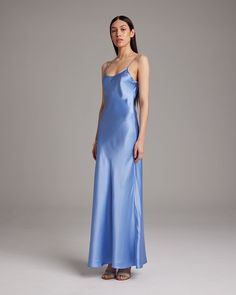 Named by Vogue as a must-have, this easy to wear luxury charmeuse slip dress is the perfect day to night staple. Featuring a bias cut and the finest silk quality, it shapes flatteringly to every type of body. Bias cut silk charmeuse slip elegantly drapes on the body. 100% Silk Charmeuse Made in New York City Model is wearing a size S and is 5'10" Product Care: Dry Clean Only City Model, The Perfect Day, Silk Slip Dress, Boatneck Sweater, Silk Tank, Silk Charmeuse, Silk Slip, Vintage Glamour, Wrap Blouse