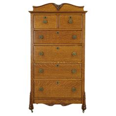 an old wooden dresser with many drawers and knobs on the top drawer, against a white background