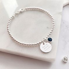 Combining our Engraved Jewellery & our Birthstone Charm to make a perfectly personalised bracelet you'll love! This beautiful silver bracelet combines our silver disc charm, perfect for engraving a name or special date, with our sparkling Swarovski birthstone charm. Unsure as to what your stone is? Use our handy graphic to find out & whilst your there find out your besties, mums & little ones too! The sterling silver disc charm measures 12mm across the front of the heart and sits centrally on a Customizable Silver Charm Bracelet, Customizable Sterling Silver Round Bracelets, Customizable Sterling Silver Bracelets, Customizable Silver Round Name Bracelet, Customizable Silver Name Bracelet, Customizable Round Sterling Silver Bracelets, Sterling Silver Round Bracelet With Birthstone, Silver Minimalist Beaded Birthstone Bracelets, Minimalist Silver Beaded Bracelets With Birthstone