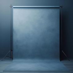 an empty photo studio with blue backdrop