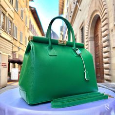 "This bag has been made of the best genuine leather by local master crafters of Florence in Italy, designed for women who only accept premium Italian quality and luxury leather bags and modern Italian fashion. . Size: Height: 28 cm/11.02 inches. Width: 33 cm/12.99 inches. Depth: 15 cm/ 5.91 inches. Color: Green . The story of this bag:  In the heart of Italy, where artistry and craftsmanship have flourished for centuries, a group of skilled artisans pours their passion into creating exquisite leather handbags. Among these masterpieces is \"The Florence Elegance,\" a handcrafted Italian leather bag that epitomizes style, grace, and practicality. This bag is more than just an accessory; it's a gift for her, a daily companion, and the perfect gift for Mom. It boasts the essence of Italian fas Luxury Green Satchel With Leather Handles, Luxury Green Bag With Smooth Grain, Luxury Green Satchel Briefcase, Luxury Green Bag With Leather Lining, Luxury Green Smooth Grain Shoulder Bag, Luxury Green Satchel With Leather Lining, Luxury Green Briefcase For Daily Use, Green Office Bags With Leather Lining, Luxury Green Bag For Business