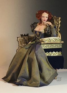 a doll sitting on top of a golden chair