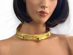 Immerse yourself in the timeless allure of ancient Egypt with our Handmade Gold Plated Open Choker Collar Necklace. Inspired by the opulence of this ancient civilization, this stunning piece combines modern design with traditional elements for a truly captivating accessory. Crafted with meticulous attention to detail, this choker features vibrant colorful crystals that add a pop of color and sparkle to your ensemble. The open collar design enhances its contemporary appeal, making it a statement Artisan Gold Choker Necklace, Adjustable Gold Choker With Gemstone, Adjustable Gold Gemstone Choker, Adjustable Gold Artisan Choker, Adjustable Artisan Gold Choker, Artisan Adjustable Gold Choker, Elegant Gold Gemstone Choker, Gold Gemstone Choker, Handmade Gold Goddess Necklaces