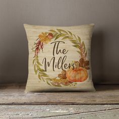 a decorative pillow with the words, the miler and pumpkins painted on it