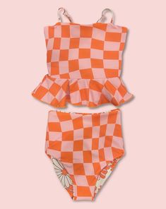 This darling tankini is basically four swimsuits in one (see the variations below). We tested the fabrics in the salty ocean, sandy beaches, pools, and hot-tubs. It is high-quality, comfortable, and SO much fun!! Truly, a combination your littles won't want to live (or swim) without ;). High-waisted reversible bottoms Peplum top Adjustable back straps High-quality double fabric Fits true-to-size Rad Swim, Crochet Tankini, Cute One Piece Swimsuits, Swimming Suits, Girls Swimwear, Modest Swimsuits, Swimming Swimsuit, Floral One Piece, Cute Bathing Suits