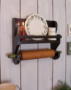 a couple of shelves that have some items on them in front of a wooden wall