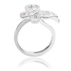 With elegance and subtlety, this Suzy Levian butterfly collection creation has become an icon of class, luxury and style. Let your creative side shine through with this whimsical double butterfly ring featuring white round and baguette shape cubic zirconia, hand set in sterling silver. This ring is designed by Suzy Levian with a message. By creating jewelry that is beautiful inside and out, Suzy Levian 's message is revealed through a hidden stone set inside the shank of this ring to empower wom Sl Logo, Double Butterfly, Butterfly Collection, Butterfly Ring, Beautiful Inside And Out, Creating Jewelry, Stone Settings, Women Empowerment, Two Tone